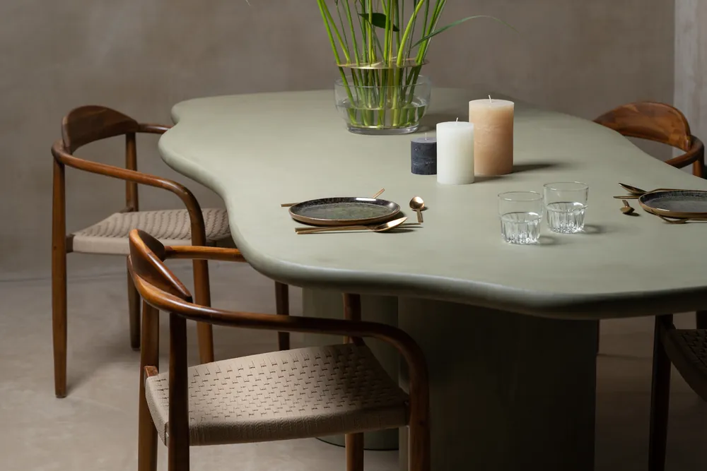 Organic dining table with an ash green mineral finish